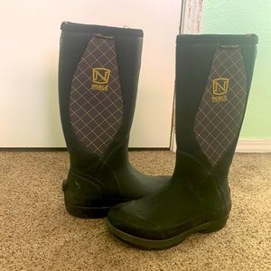 Black tall muck style winter boots.